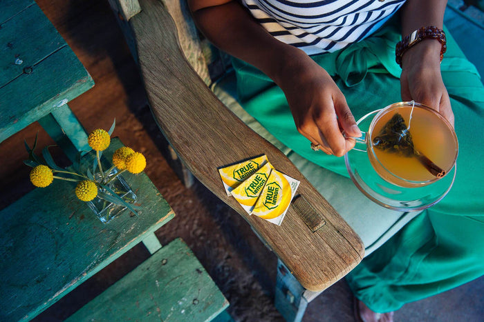 True Lemon packet sitting on the arm of a wooden chair