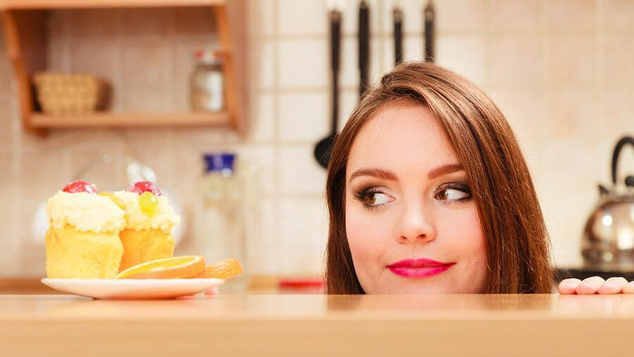 women stares humorously at lemons